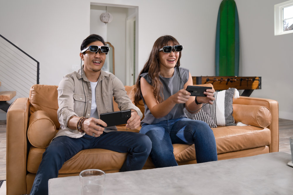 a couple enjoying 5G AR game on the couch
